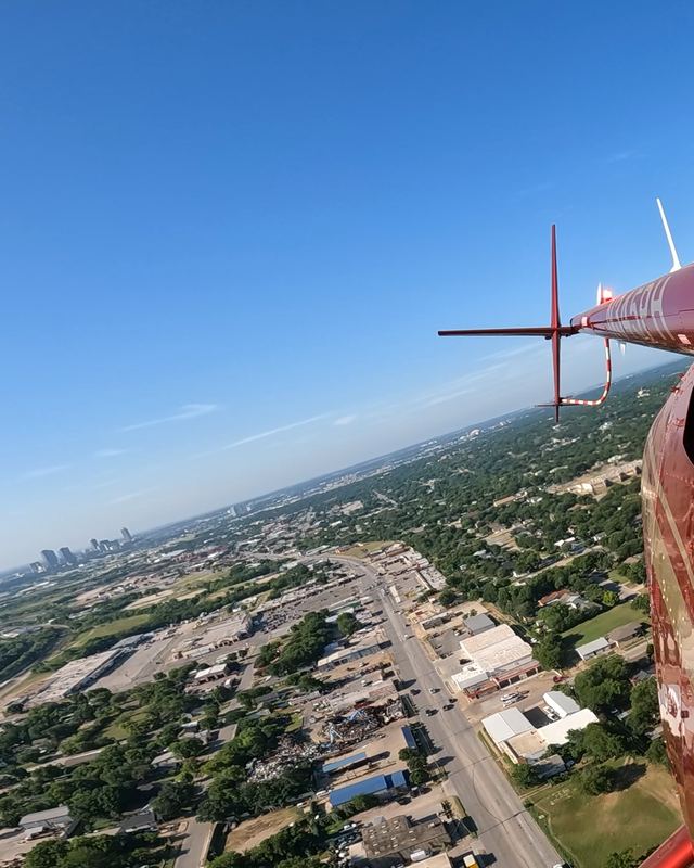 Helicopter tail rotor over a city seen from the air